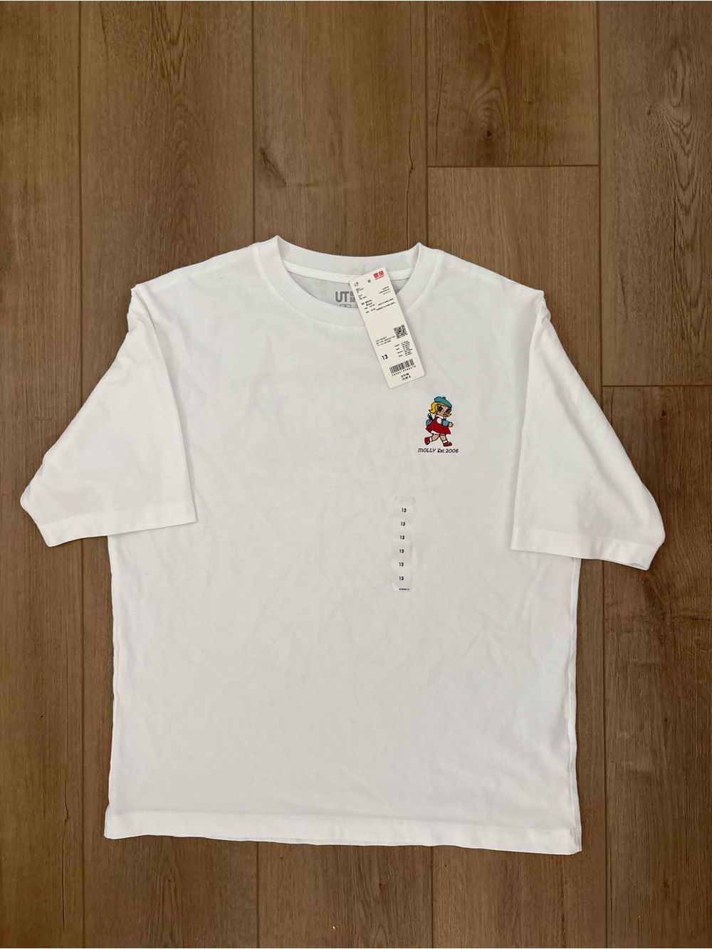 Uniqlo White Kids Tee with Small Colorful Character Print
